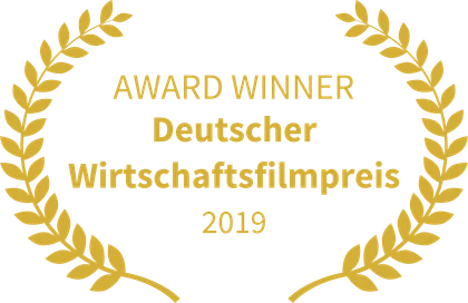 Goldener Lorbeerkranz mit der Aufschrift „Award Winner, Deutscher Wirtschaftsfilmpreis 2019“